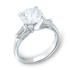 Round Cut Blue Luster Diamond with a Baguette on Either Side
